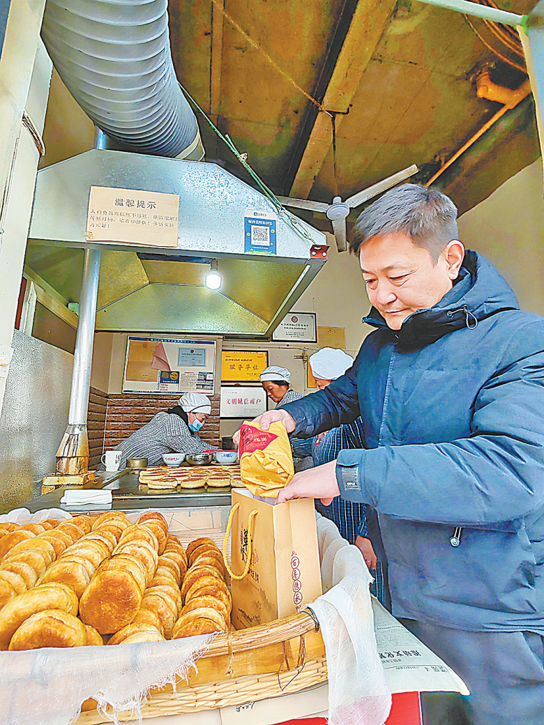 烧饼：祭灶日的烟火传奇尊龙凯时APP靳贤书(图1)